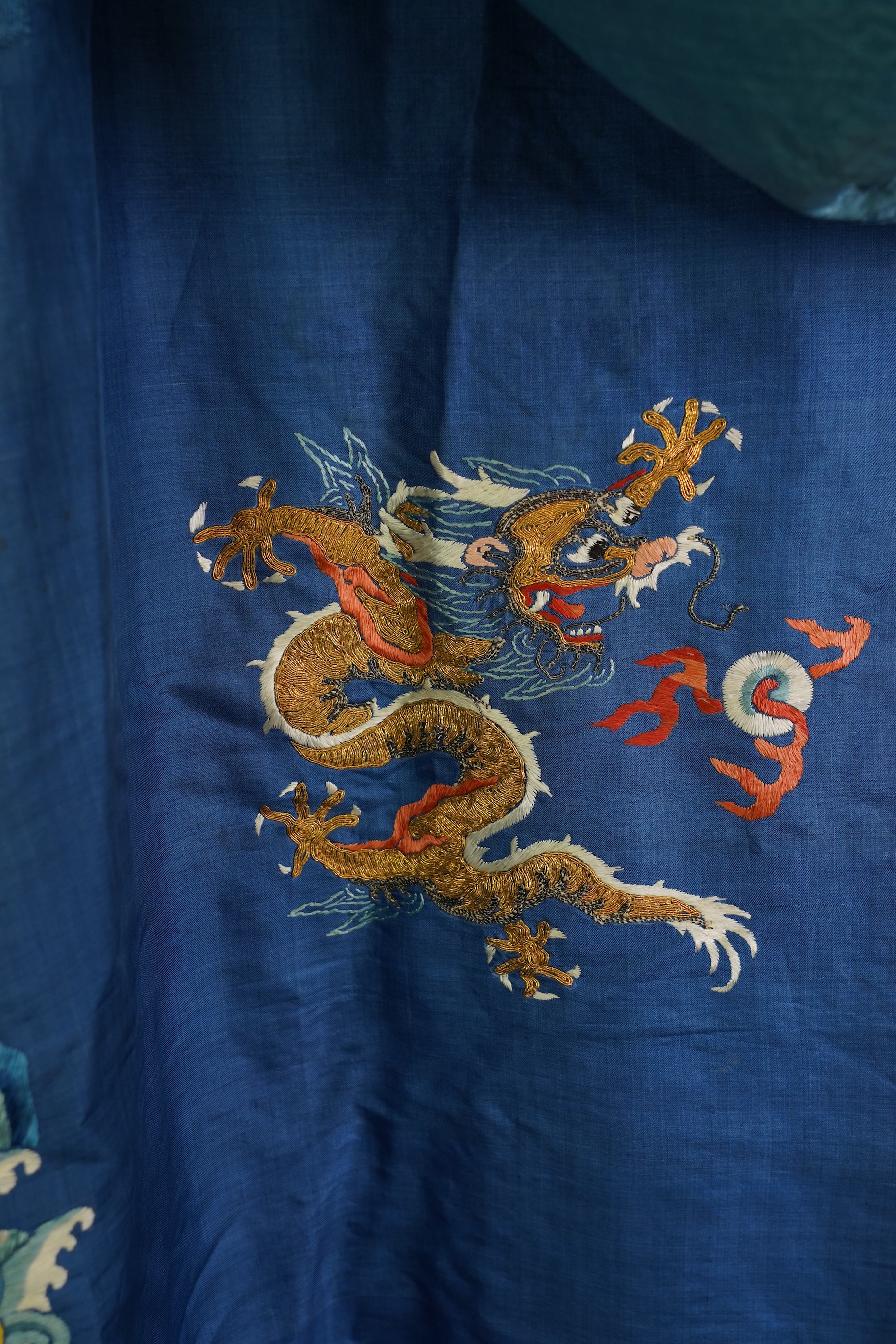 A Chinese blue silk man’s dragon robe, jifu, 19th century